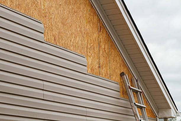Professional Siding Contractor technician working in Marco Island, FL